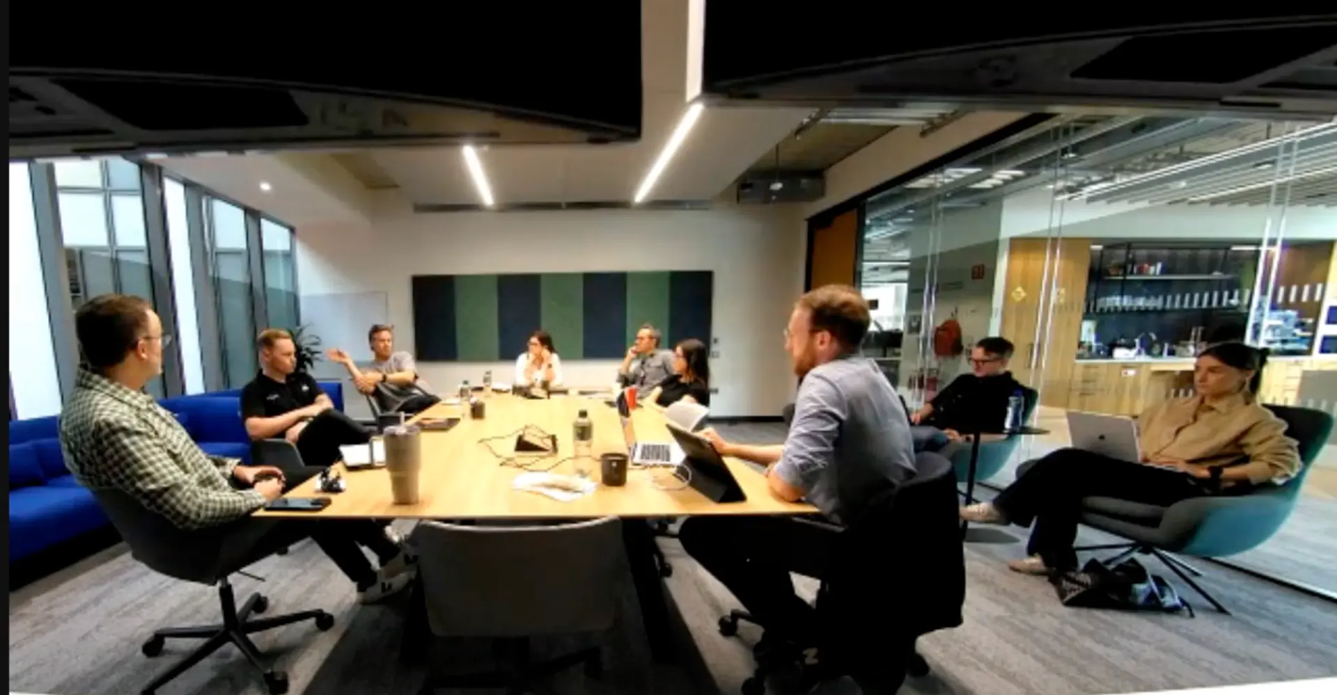 Team leads in a training session around a conference table