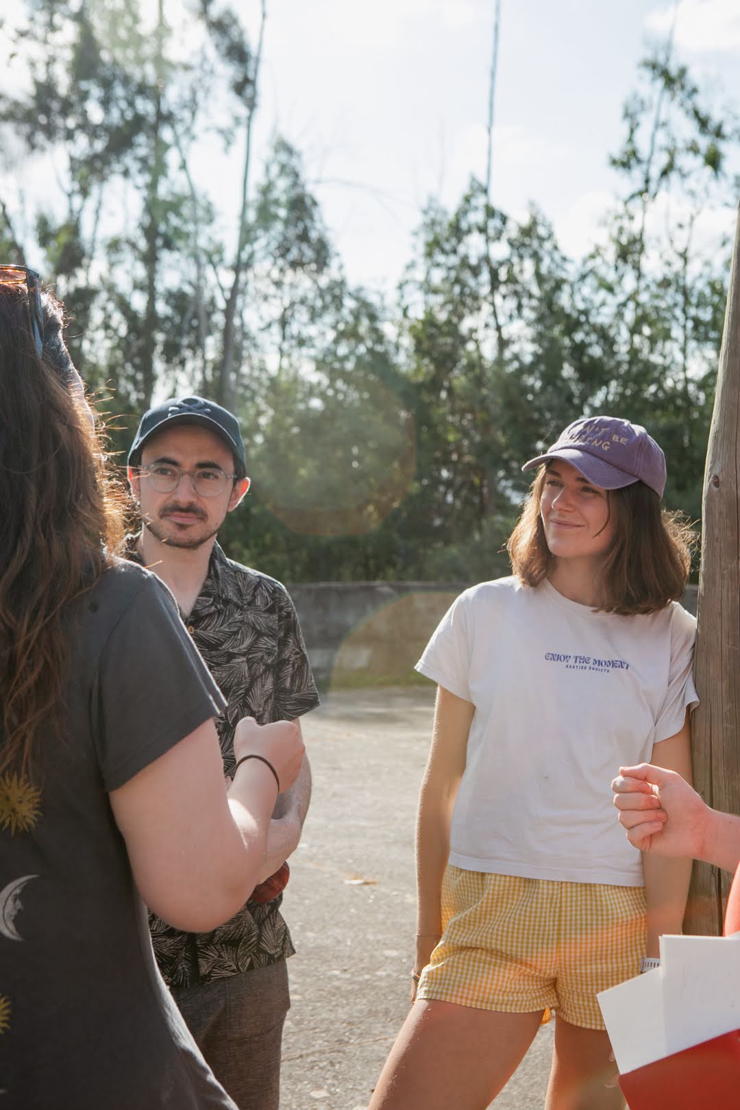 Three team members in conversation at Bela Colina